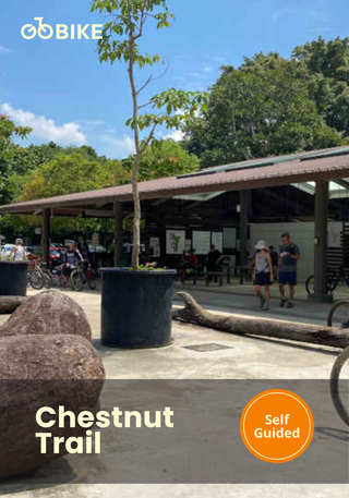 Chestnut Trail self-guided ride with people walking and a building in the background