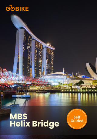 MBS Helix Bridge with Marina Bay Sands in the background at night with GoBike Singapore.