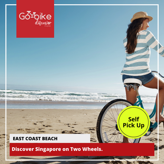 A woman cycling with passion on the East Coast Beach in Singapore, riding her GoBikeSG.