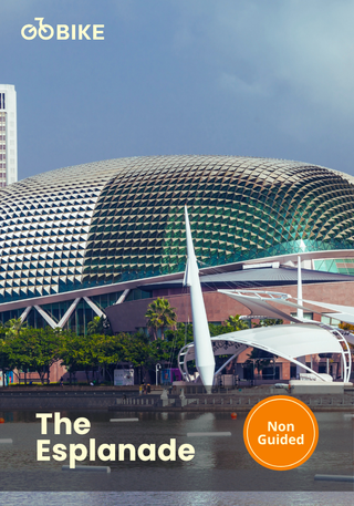 Cyclist riding past Marina Bay Sands on a self-guided bike tour in Singapore
