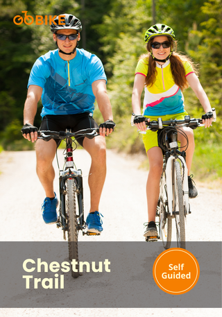 Two people riding bicycles on a trail with 'GoBike at Chestnut Trail.